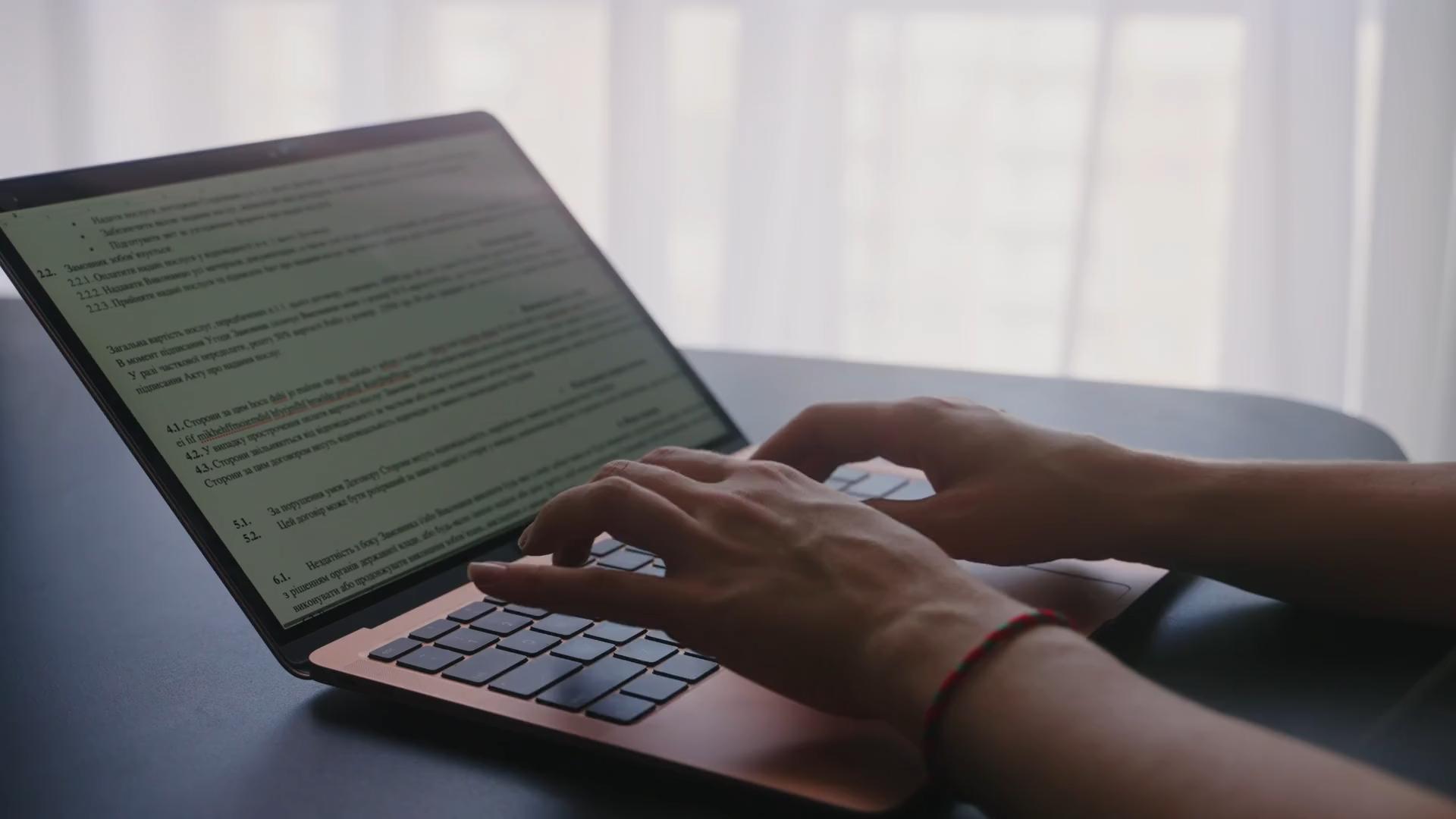camera-slides-around-female-freelancers-hands-typing-on-laptop-keyboard-in-slow-mot-SBV-347264393-HD_22.jpeg